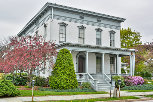 Honesdale, Pennsylvania, United States of America - April 30, 2017. Zenas H. Russell Home at 803 Church St in Honesdale, PA. Now the editorial office for Highlights for Children magazine, the Russell mansion was finished in 1869. A man of many business interests, Mr. Russell was a member of the organizers of Grace Episcopal Church, the Honesdale Bank, Honesdale Gas Co., and many others.