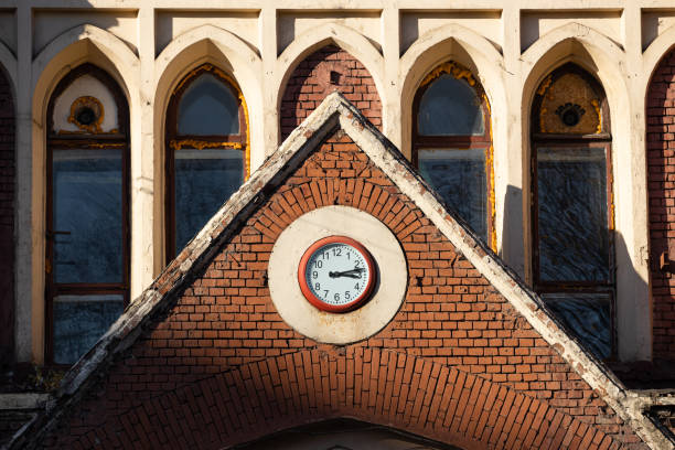 clock on the old architecture building in the city. outdoor clock