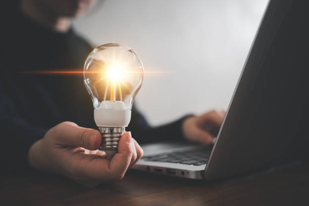 istock Innovation design concept. Hand holding light bulb for new idea brain storming creative inspiration. 1435866752