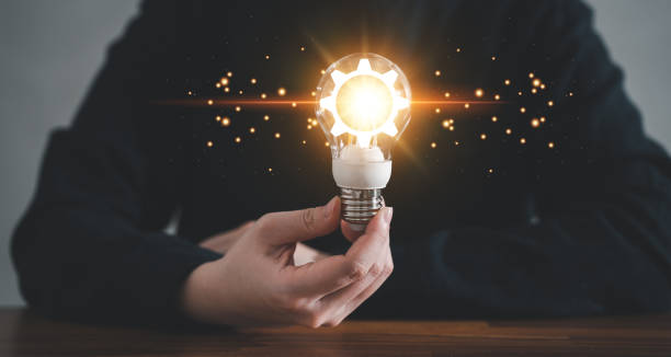 istock Innovation design concept. Hand holding light bulb for new idea brain storming creative inspiration. 1435866753