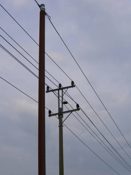 istock electric cable pylons against a cloudy sky 1435866851