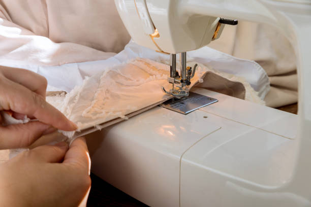 istock Workplace of tailor seamstress sews clothes 1435867303
