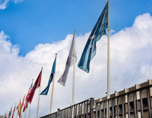 istock A row of flags on flagpoles. 1435867966
