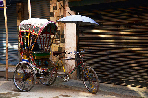 Classic antique vintage retro rickshaw trishaw bicycle of nepalese people for nepali passengers and foreign travelers use service journey in bazaar market old town at thamel city in Kathmandu, Nepal