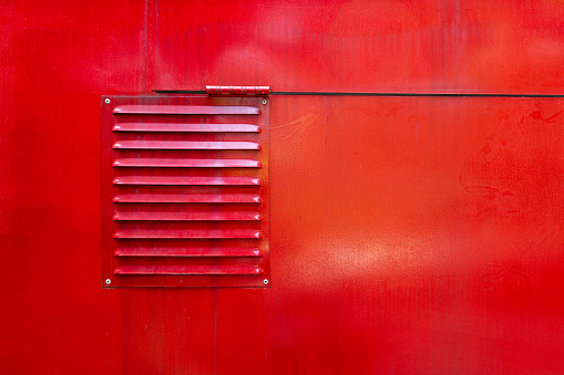 Air vent on red background
