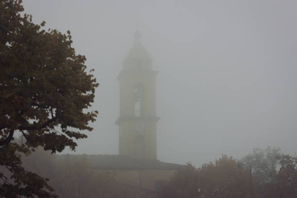 istock Marcialla old Tuscan Town with fog 1435873195