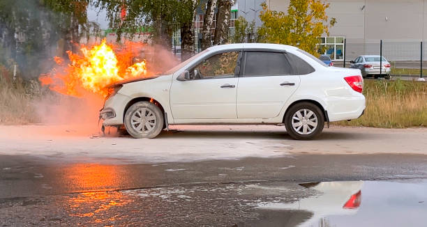 An Asian woman is disinfecting the car interior.