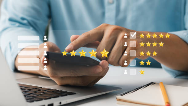 istock User give rating to service experience on online application, Customer review satisfaction feedback survey concept, Customer can evaluate quality of service leading to reputation ranking of business. 1435873670
