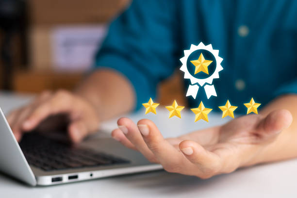 istock User gives rating to service experience on online application, Hand of Client giving a Five Star Rating, Customer can evaluate quality of service leading to reputation ranking of business. 1435874680