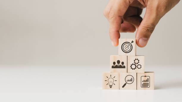 istock hand woods block cube with icon company strategy development, Concept success and business goals. 1435874760