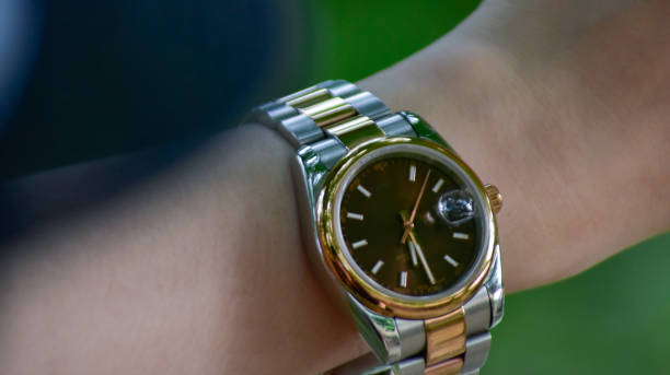 istock wrist watch on a girl's arm 1435875287