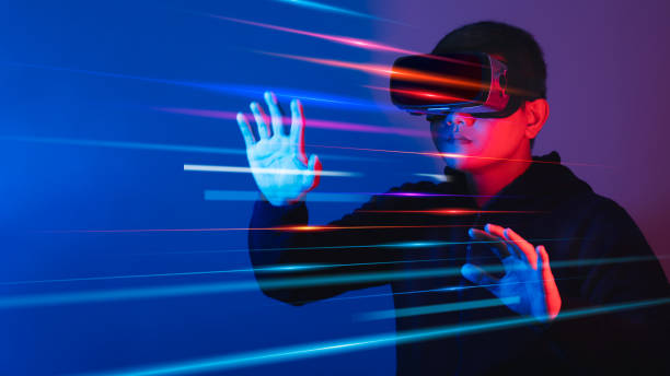 istock Young man wearing VR goggles. Metaverse technology virtual reality concept. Virtual Reality Device, Simulation, 3D, AR, VR, Innovation and Technology of the Future on Social Media. 1435875349