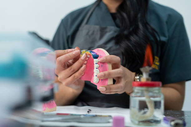 istock Hands of a dentistry student working in class with her work implements 1435875509