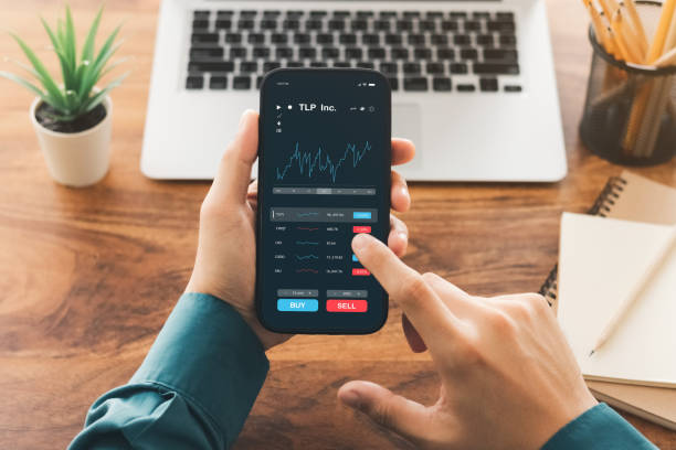 istock Businessmen work with stock market investments using smartphone to analyze trading data. smartphone with stock exchange graph on screen. Financial stock market. 1435877497