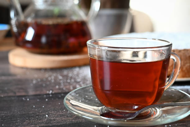 istock A Cup of freshly brewed black tea,escaping steam,warm soft light, darker background. 1435877573