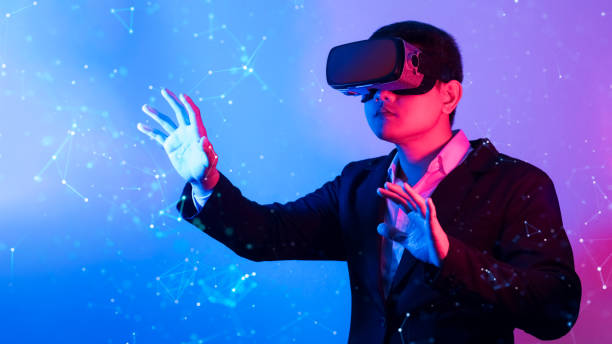 istock Young man wearing VR goggles. Metaverse technology virtual reality concept. Virtual Reality Device, Simulation, 3D, AR, VR, Innovation and Technology of the Future on Social Media. 1435878059