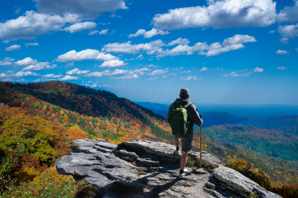 istock Man relaxing on autumn hiking trip. 1435878725