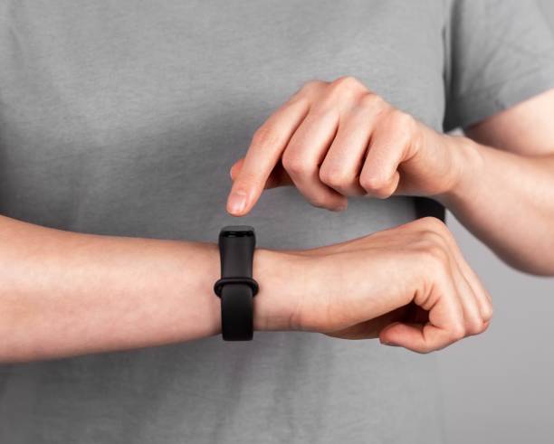 istock Using black smart fitness watch, bracelet on hand 1435879809