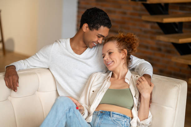 istock Young couple looking happy and in love 1435885788