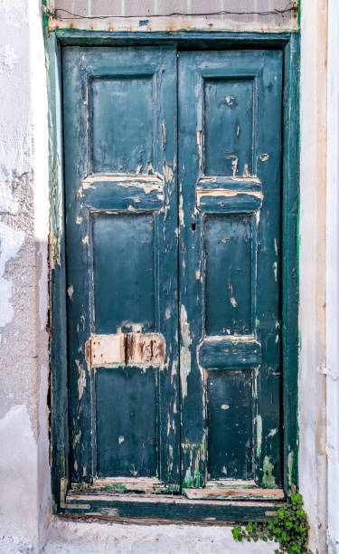 istock Old, weathered paint on a Greek door 1435889555