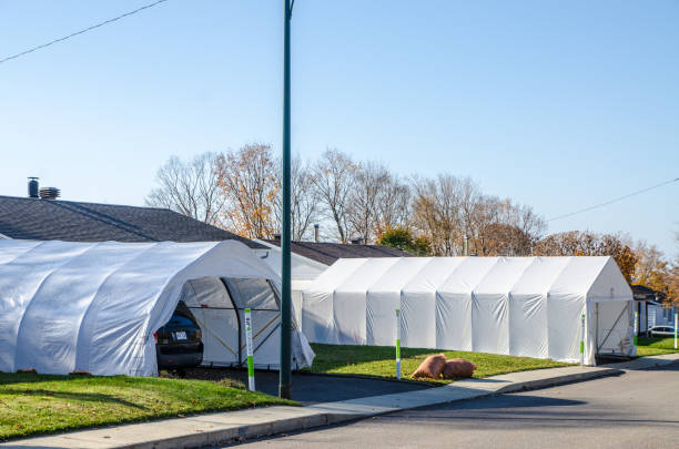 Bungalow with winter car shelter during day of autumn