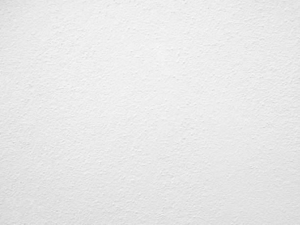 istock Seamless texture of white cement wall a rough surface, with space for text, for a background,concrete,retro vintage concept.. 1435893068