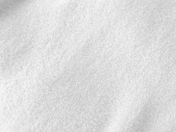 istock White clean wool texture background. light natural sheep wool. white seamless cotton. texture of fluffy fur for designers. close-up fragment white wool carpet. 1435893091