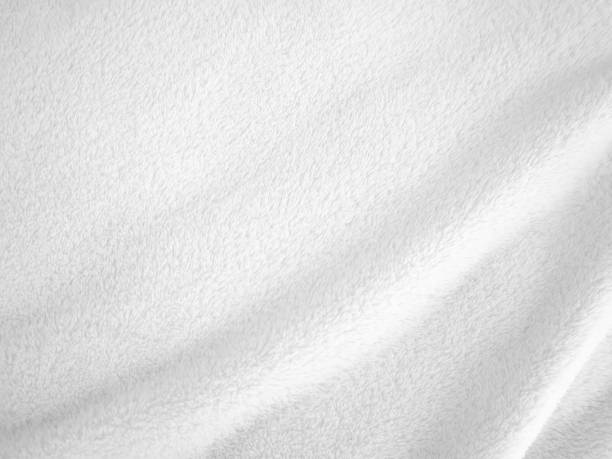 istock White clean wool texture background. light natural sheep wool. white seamless cotton. texture of fluffy fur for designers. close-up fragment white wool carpet. 1435893122