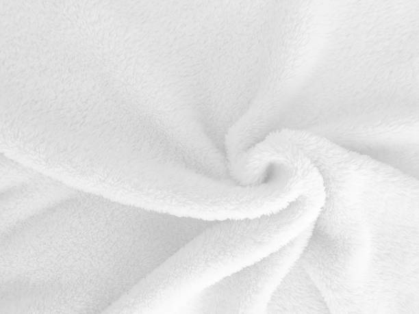 istock White clean wool texture background. light natural sheep wool. white seamless cotton. texture of fluffy fur for designers. close-up fragment white wool carpet. 1435893165