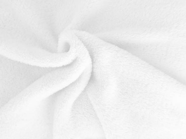 istock White clean wool texture background. light natural sheep wool. white seamless cotton. texture of fluffy fur for designers. close-up fragment white wool carpet. 1435893166
