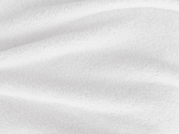istock White clean wool texture background. light natural sheep wool. white seamless cotton. texture of fluffy fur for designers. close-up fragment white wool carpet. 1435893216