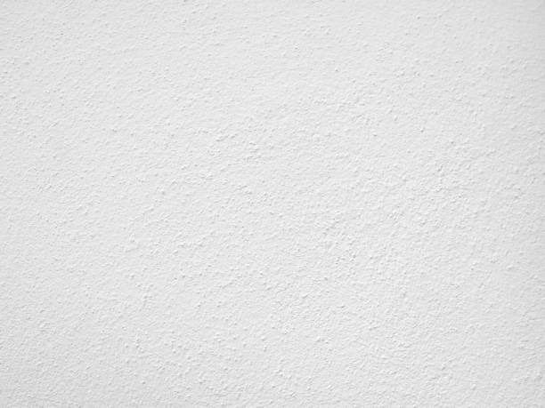 istock Seamless texture of white cement wall a rough surface, with space for text, for a background,concrete,retro vintage concept.. 1435893233