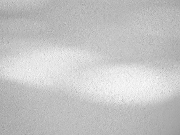 istock Seamless texture of white cement wall a rough surface, with space for text, for a background,concrete,retro vintage concept.. 1435893236