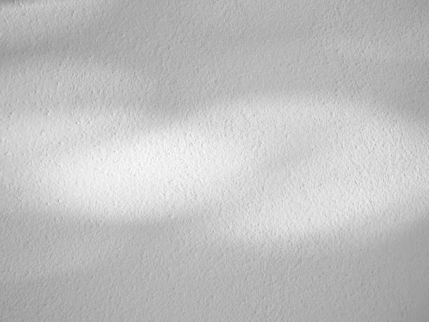 istock Seamless texture of white cement wall a rough surface, with space for text, for a background,concrete,retro vintage concept.. 1435893239