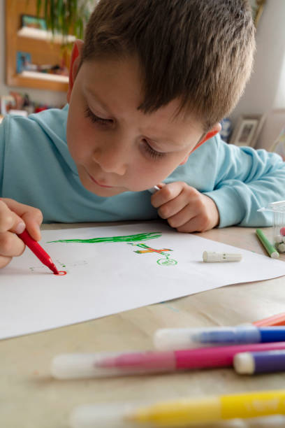 istock Little boy painting 1435893950