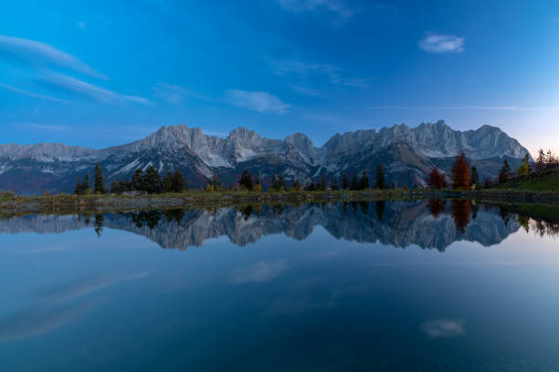 istock Wilder Kaiser mountains reflected in lake Astbergsee 1435895446
