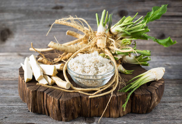Fresh organic horseradishes on the wooden table Fresh organic horseradishes on the wooden table horseradish stock pictures, royalty-free photos & images