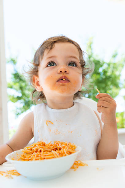 istock Little Child Eating Pasta 1435896902