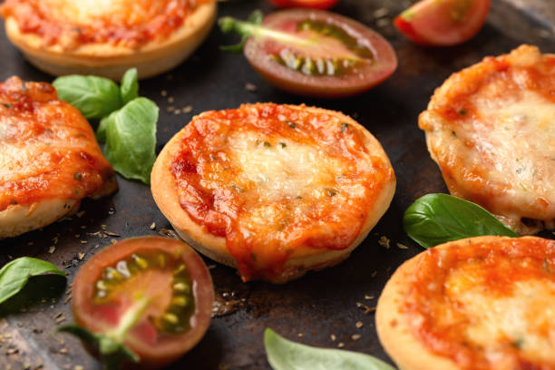 istock Mini pizzas with tomatoes and mozzarella cheese 1435897353