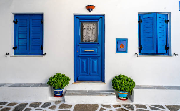 istock Blue door in classic Cyclades style in Greece 1435899611