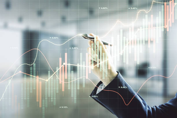 istock Multi exposure of businessman hand with pen working with virtual creative financial chart hologram on blurred office background, research and analytics concept 1435900254