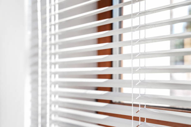 istock blinds. Office blinds. Modern wooden jalousie. Office meeting room lighting range control. 1435906251