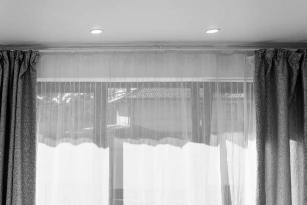 istock Curtain on the window. empty room with window and curtains 1435906480