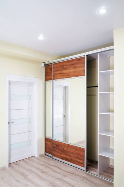 istock Wardrobe with mirror. Interior of modern empty wardrobe room. 1435906555