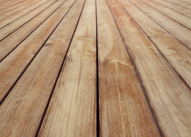 istock Old weathered light brown wooden deck floor pattern perspective background and wallpaper idea 1435906978