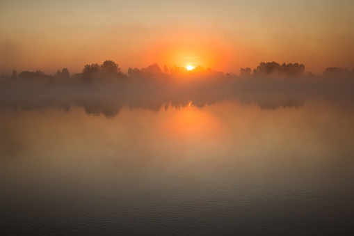 Foggy dawn over the river