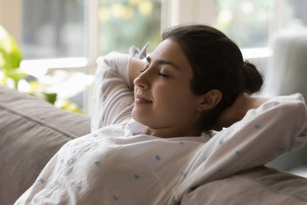 istock Peaceful Indian woman relaxing leaned on cozy couch, close up 1435908426
