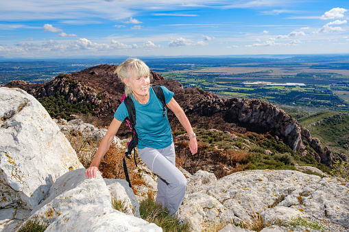 Young people are hiking in Carpathian mountains in summertime