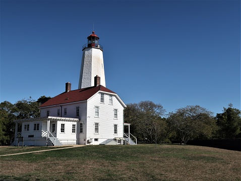 Built in 1764, the lighthouse is located within the Fort Hancock section of Sandy Hook, New Jersey.  It is the oldest still existing lighthouse in the United States, and is still functional.