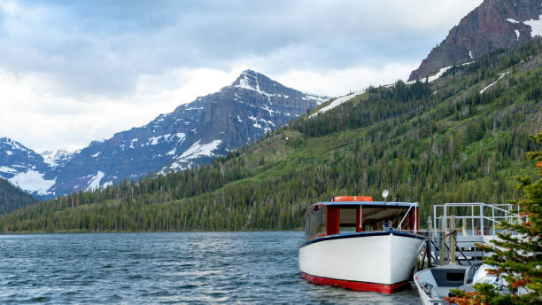istock Glacier National Park lake with passenger boat 1435910923